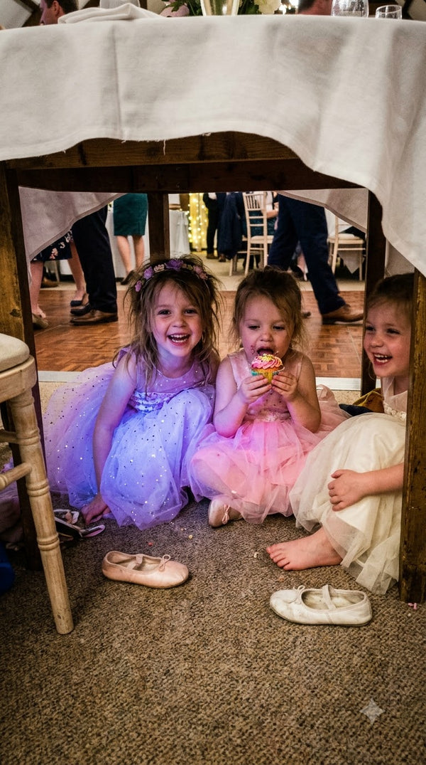 ugc children hiding under banquet table